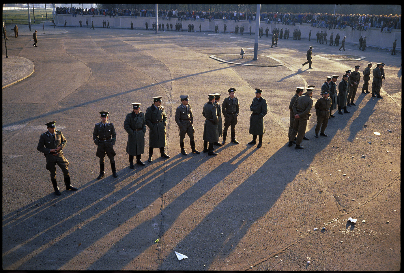 East German police monitor the "Berlin Wall" the day the Wall finally opened  1989 : Too Close UMFA : David Burnett | Photographer