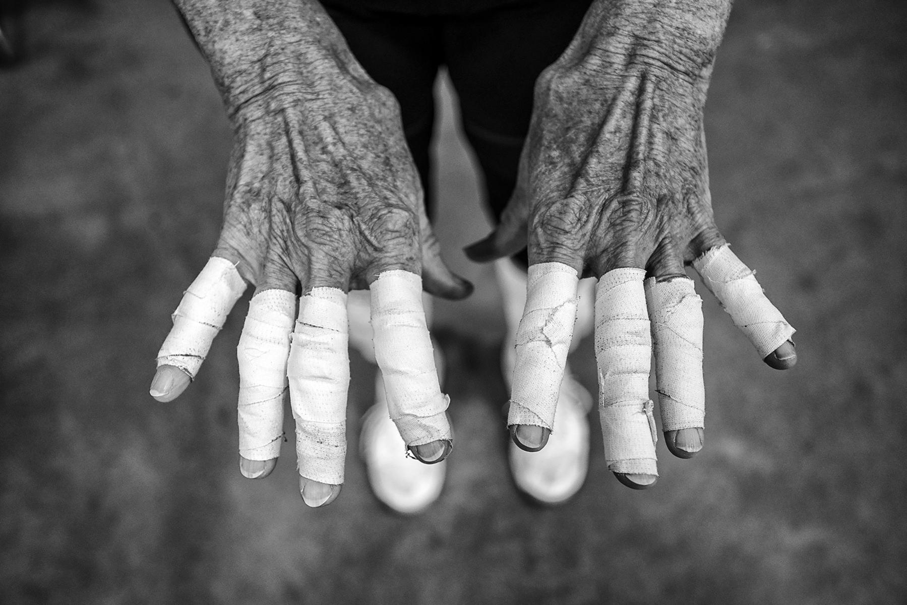 Taped hands before Womens Volleyball : Senior Athletes : David Burnett | Photographer