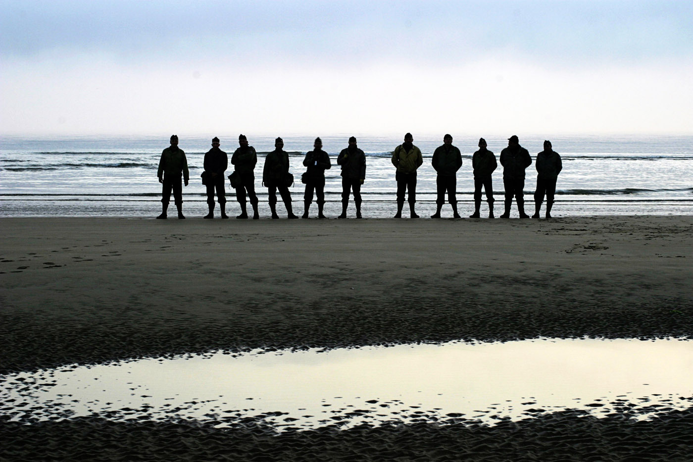 A small crew of Dutch re-enactors (there are hundreds of them), Omaha Beach, 0600h, D-Day + 60 years