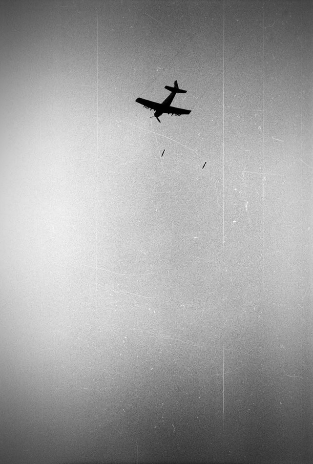 A Viet Nam Air Force Skyraider drops napalm at Trang Bang, 1972 : Too Close UMFA : David Burnett | Photographer