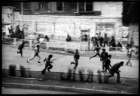 The sound of gunshots sends demonstrators running: Tehran Iran, 1979 - ©2025 David Burnett.<br/>All rights reserved.