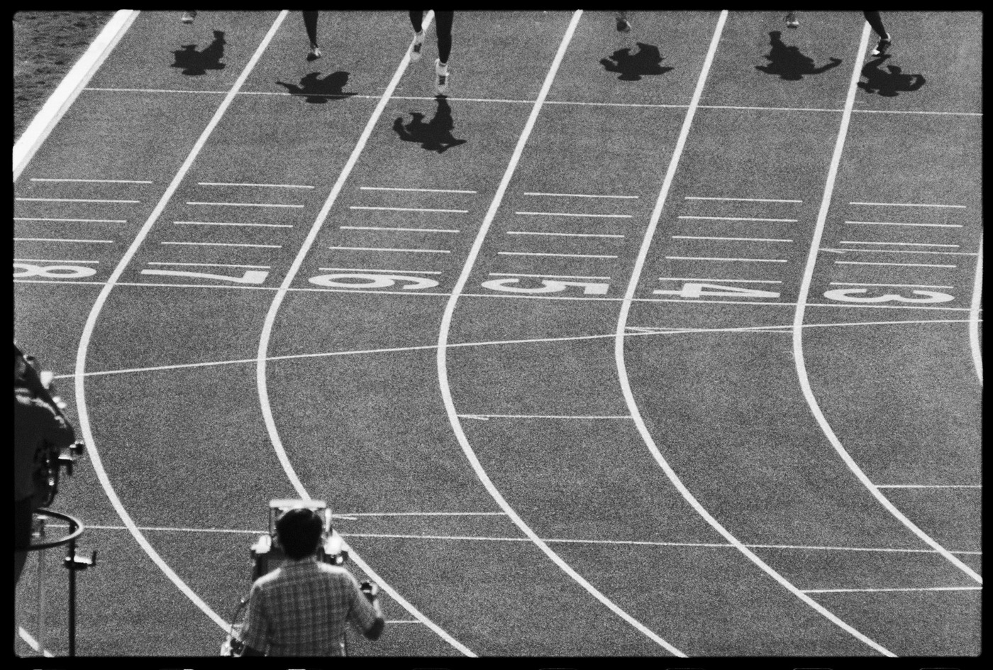 U S runner Carl Lewis touches the finish line as he racks up one of his 4 Gold Medals, LA 1984 Olympics : Too Close UMFA : David Burnett | Photographer