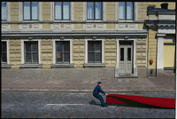 A workman readies a red carpet for Pres. Ronald Reagan, Helsinki 1988 - ©2025 David Burnett.<br/>All rights reserved.