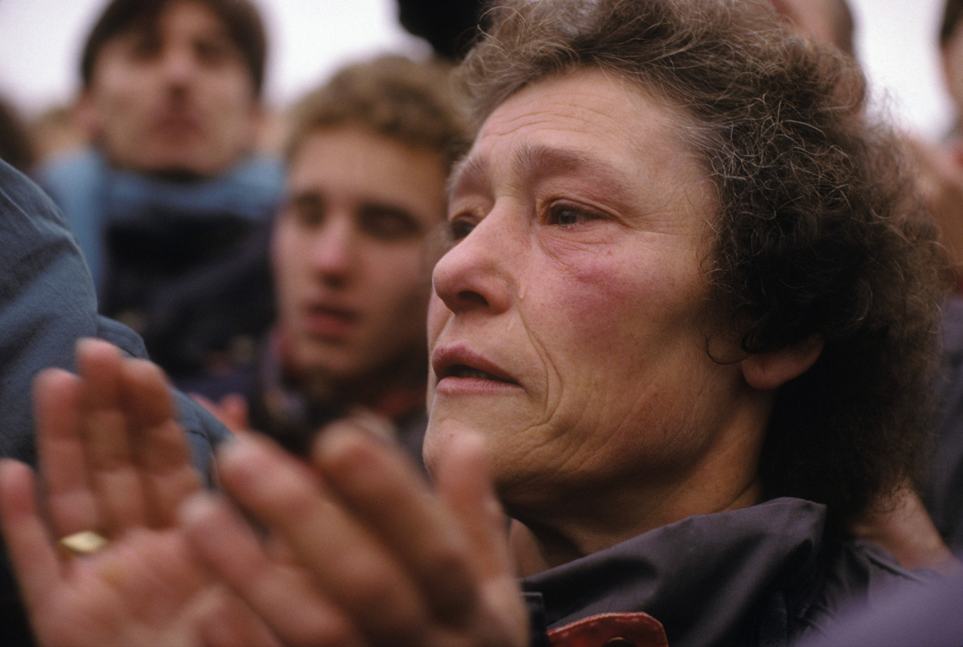A West Berlin woman tearfully welcomes her Eastern family