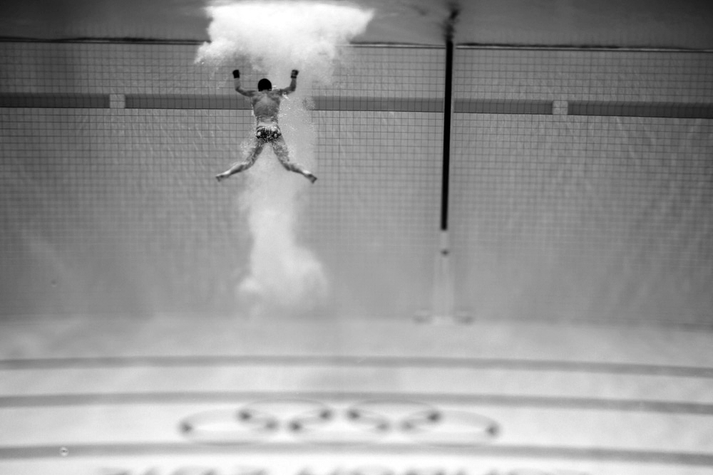 A diver, heads out of the water. : London 2012 / Olympics : David Burnett | Photographer