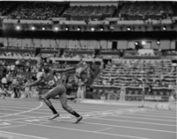 A US runner in the 4x400 awaits the baton