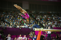 Gabbie Douglas on dismount from the beam - ©2025 David Burnett.<br/>All rights reserved.