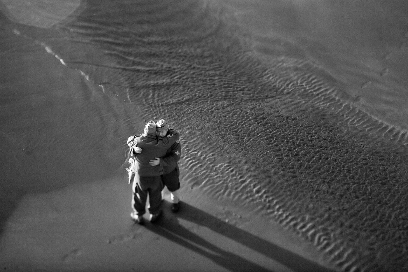 Two men hug in recognition of D-Day+70 Years: