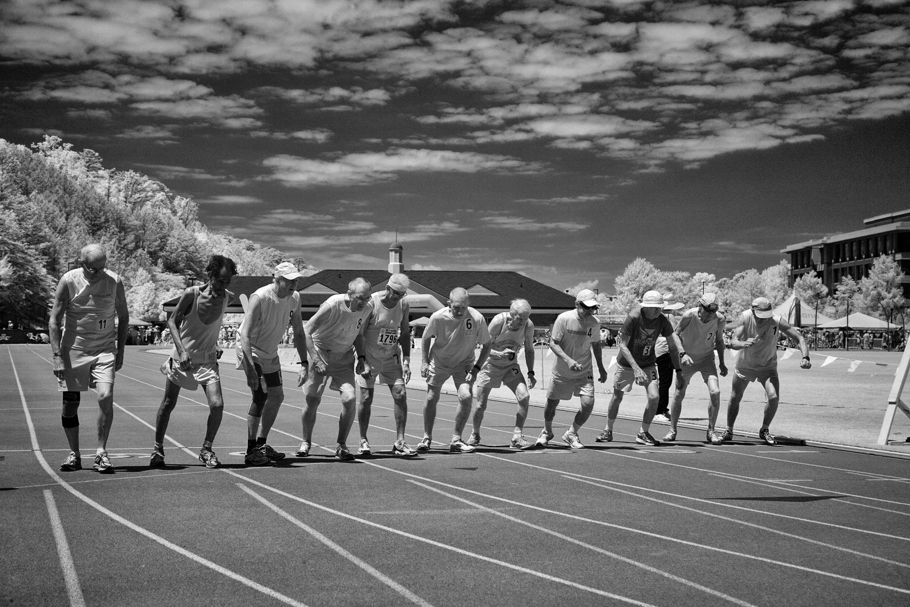 At the start of a men's  80+ 100m race