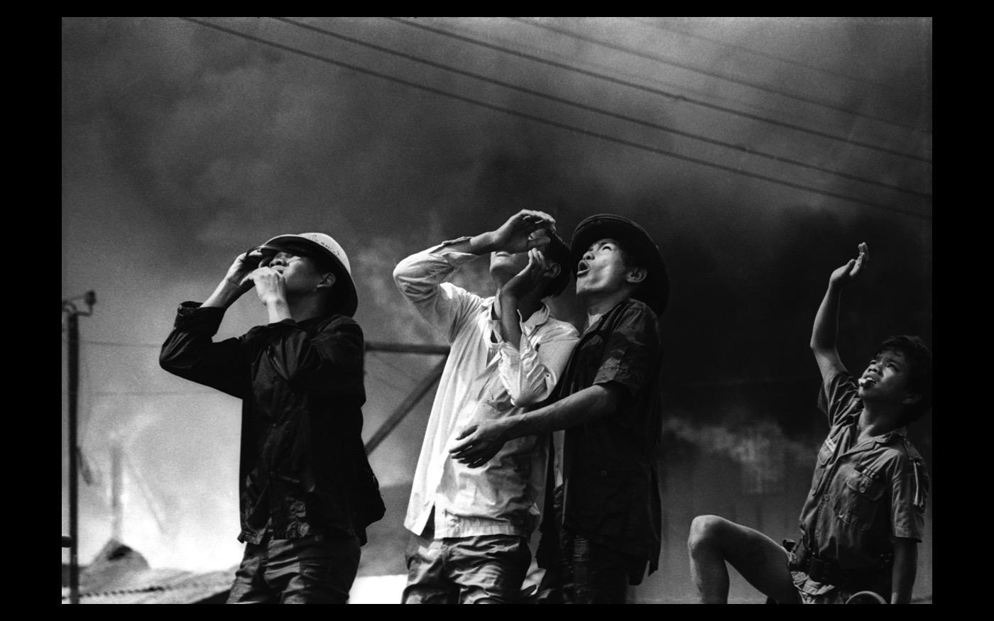 Firefighters at work following a market fire in Saigon, Vietnam  1971 : Looking Back: 60 Years of Photographs : David Burnett | Photographer