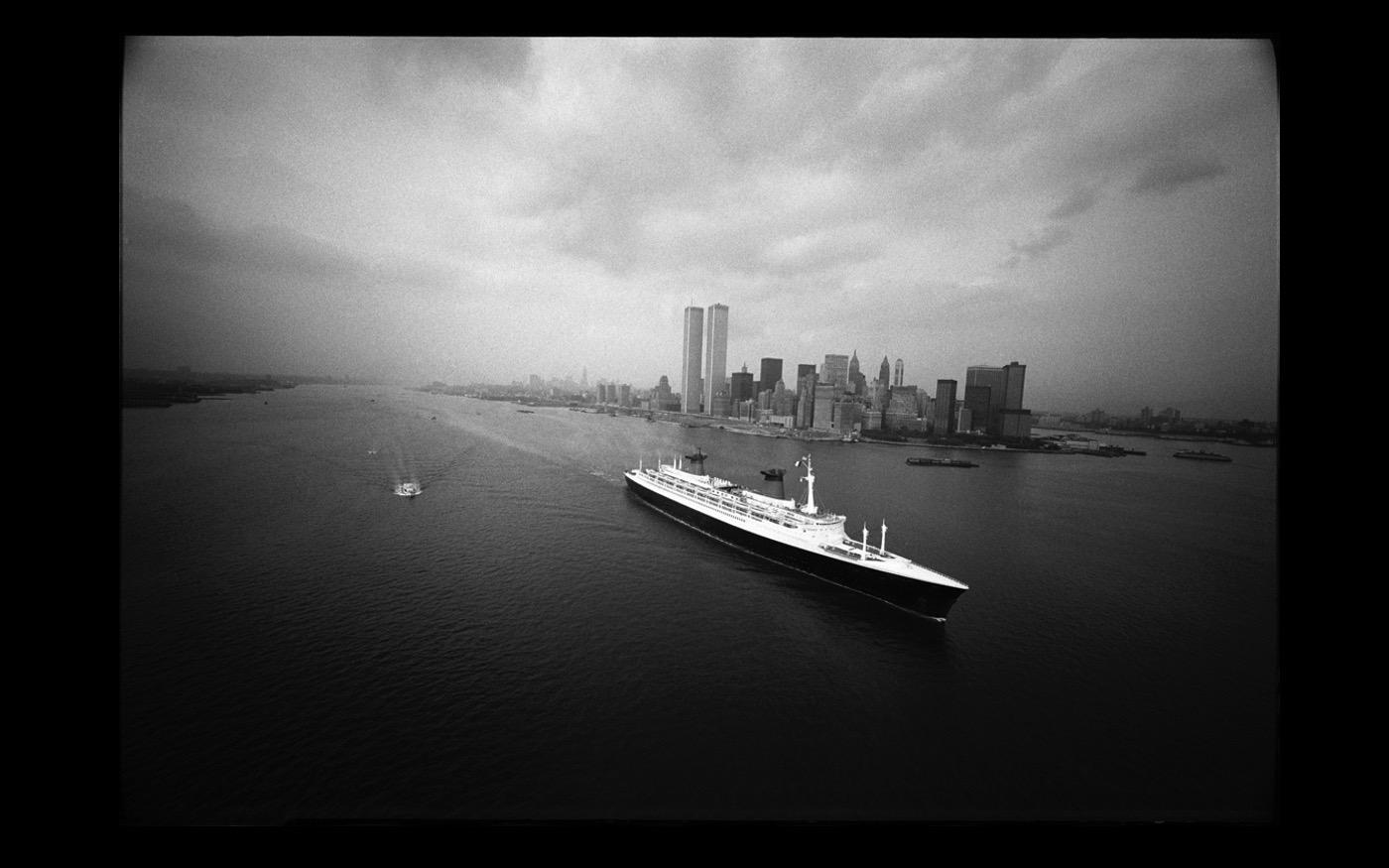 Leaving NY for the last time, the SS France passes by the newly opened World Trade Center towers  1974 : Looking Back: 60 Years of Photographs : David Burnett | Photographer