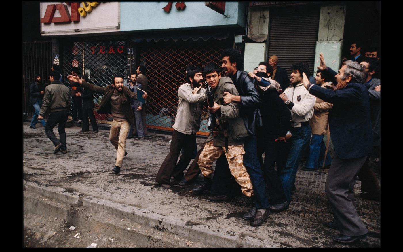 Anti Shah demonstrators try restraining a soldier during a large demonstration  1978 : Looking Back: 60 Years of Photographs : David Burnett | Photographer