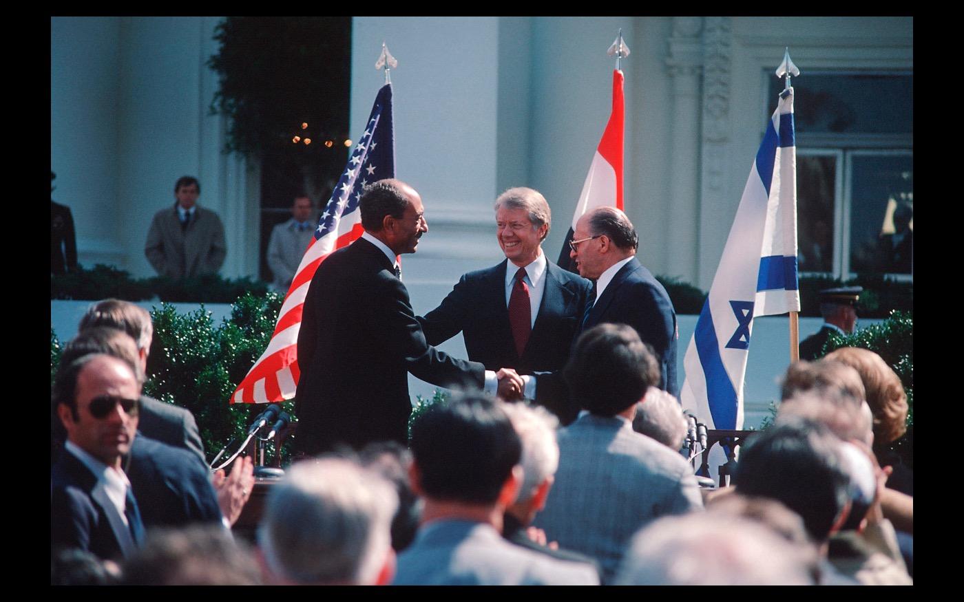 Gathered by President Jimmy Carter, Egyptian President Sadat and Israeli Prime Minister Begin sign the Camp David accords at the White House 1979 : Looking Back: 60 Years of Photographs : David Burnett | Photographer