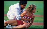 Famed American long distance runner Mary Decker lays in agony beside the track infield, after her collision with Zola Budd LA Olympics 1984 - ©2024 David Burnett.<br/>All rights reserved.
