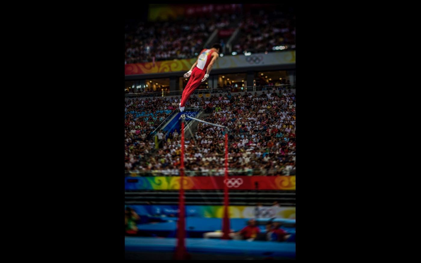 Aloft, and going up, a Gymnast at the 2008 Beijing Olympics : Looking Back: 60 Years of Photographs : David Burnett | Photographer