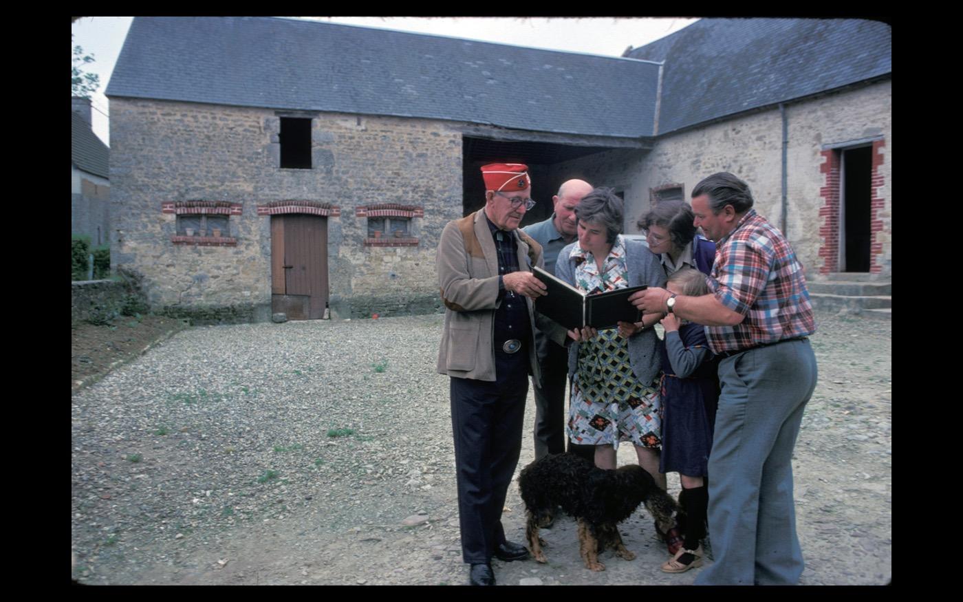 An American veteran brings a scrapbook of pictures he shot in 1944, to a family living in a farmhouse where he had taken refuge 40 years before : Looking Back: 60 Years of Photographs : David Burnett | Photographer