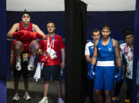 Boxers, both Red and Blue, just before entering the Boxing ring - ©2024 David Burnett.<br/>All rights reserved.