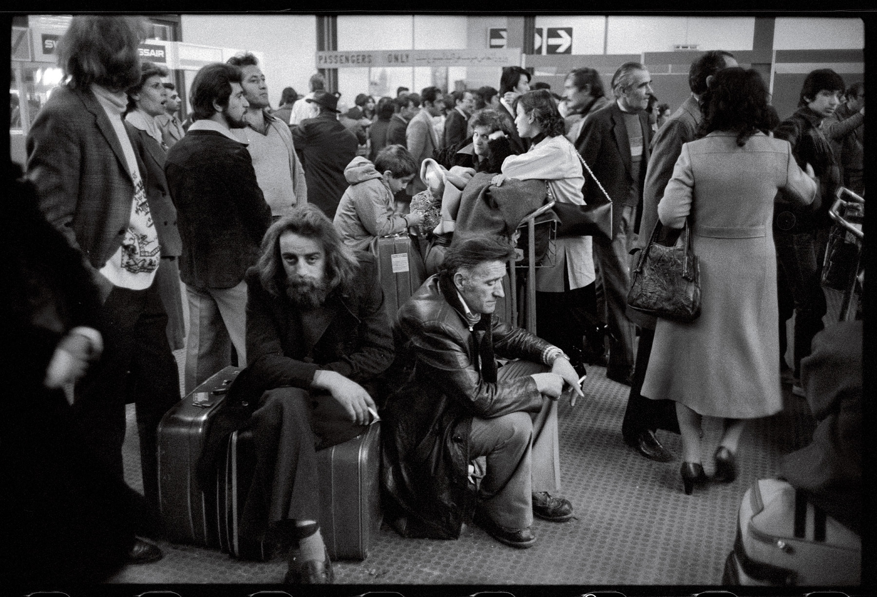 Meanwhile, thousands of expats, no longer feeling safe, huddle at Mehrabad airport in hopes of a flight out of the country. : 44 Days: the Iranian Revolution : David Burnett | Photographer