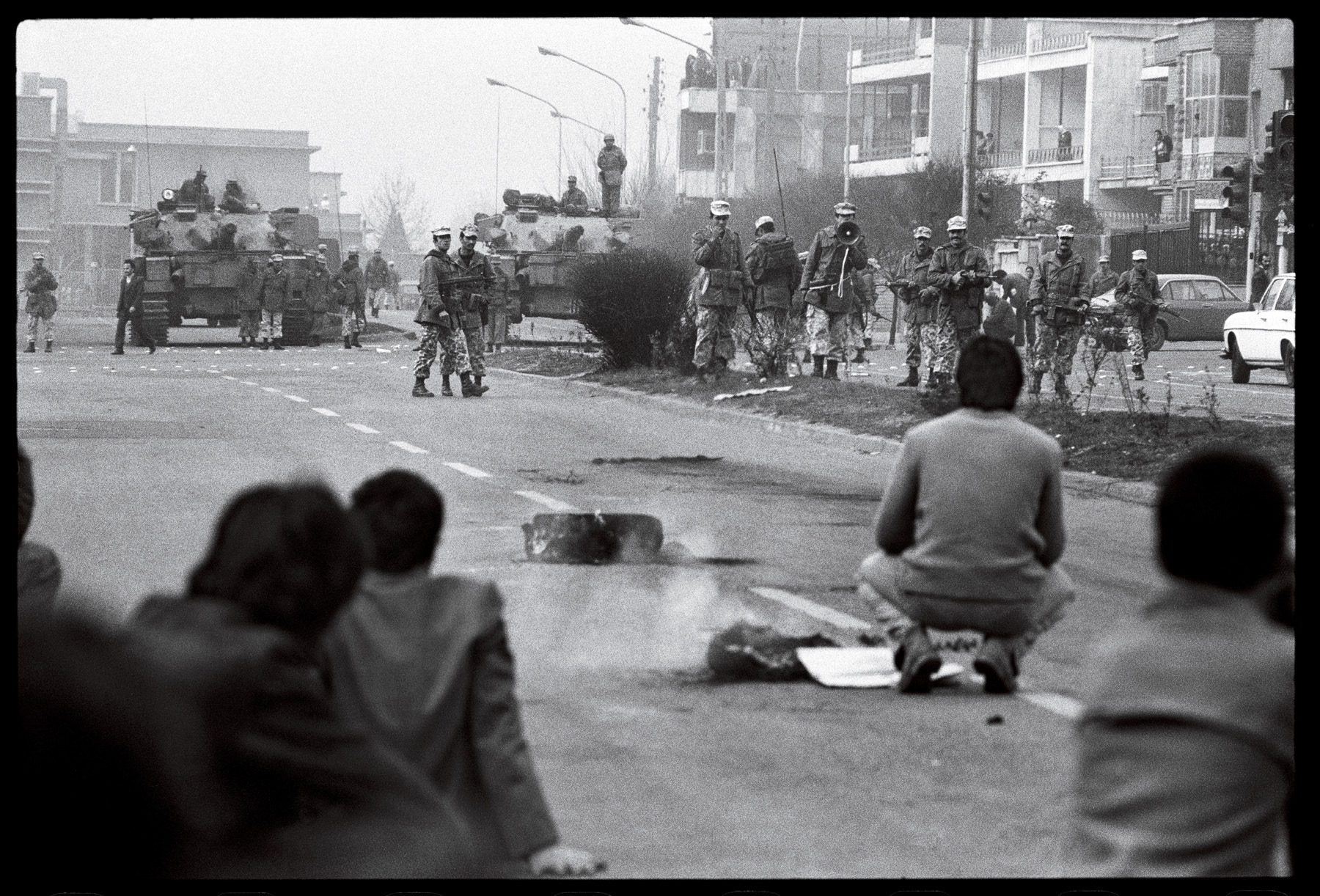 Confrontations between the Shah's police and demonstrators. : 44 Days: the Iranian Revolution : David Burnett | Photographer