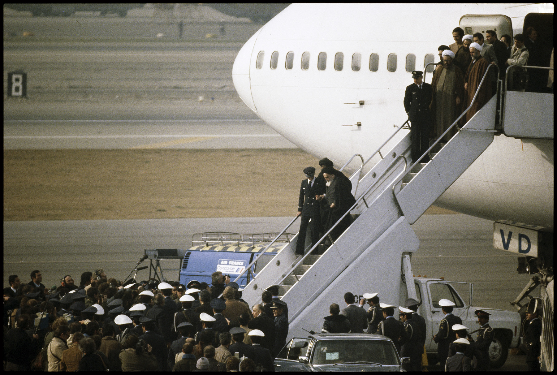 Ayatollah Khomeini arrives in Tehran on Air France, to an uncertain future.