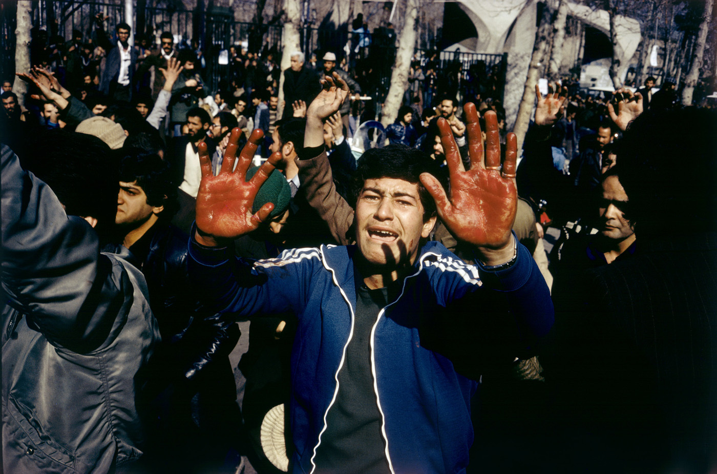 The day before Khomeini's return, a calm sunny day turned tragic when a student was shot by one of the Shah's palace guard. : 44 Days: the Iranian Revolution : David Burnett | Photographer
