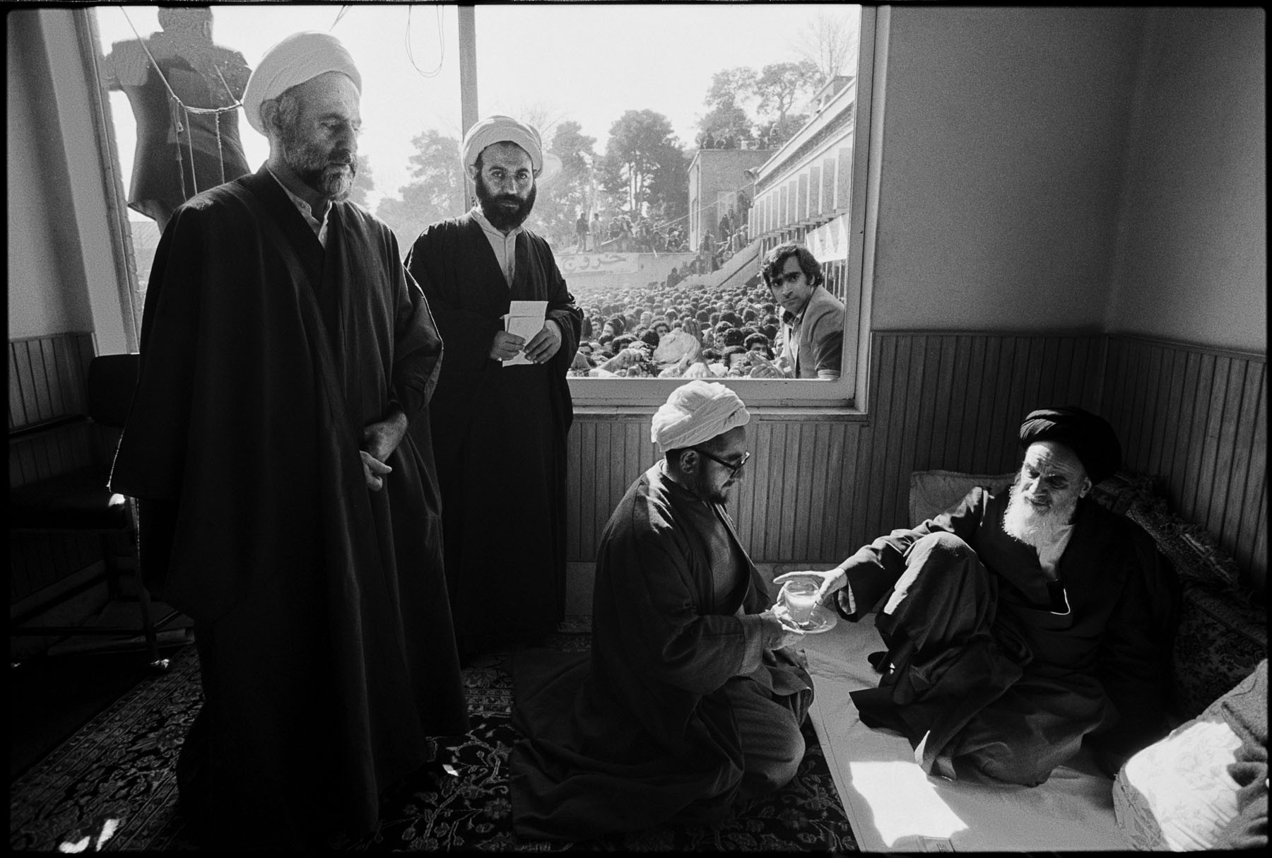 Far from the noisy, adoring crowds, Ayatollah Khomeini puts down a tea cup : 44 Days: the Iranian Revolution : David Burnett | Photographer
