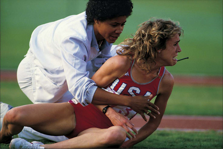 Her dreams dashed after colliding with Zola Budd, Mary Decker looks on in pain: 1984 Olympics