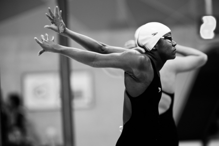A swimmer limbers up before a race