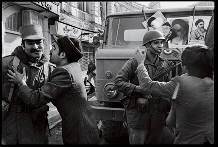 Soldiers are embraced by anti-Shah demonstrators.
