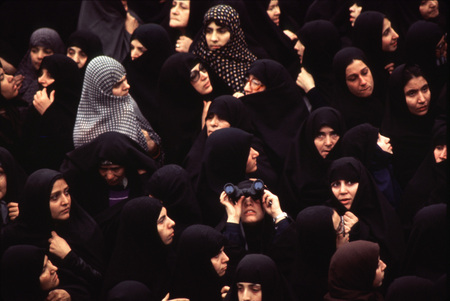 Outside Khomeini's room at the school, hundreds of chador-clad women gather to see a glimpse of the Ayatollah.